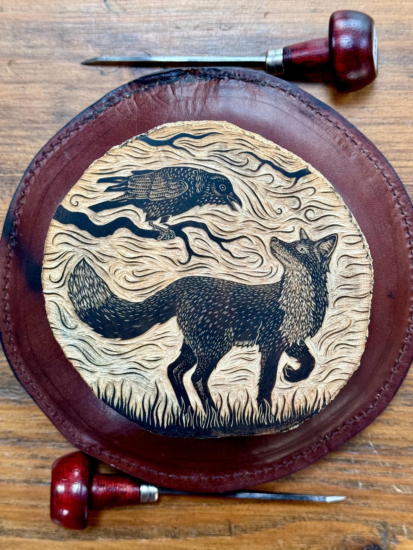 The Trickster fox and crow wood engraving