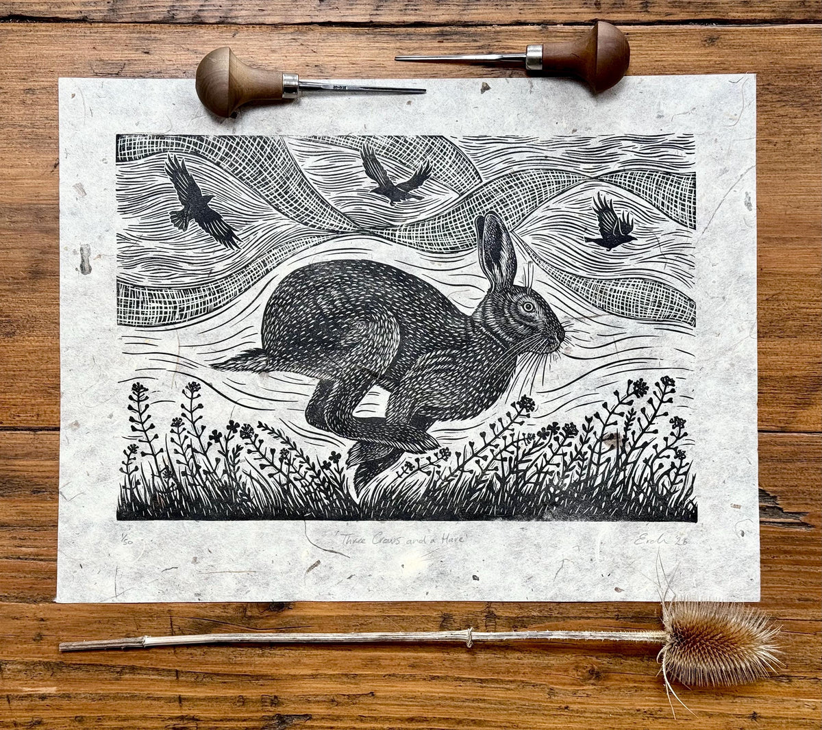 Linocut print of hare and crows