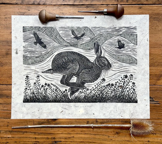 Linocut print of hare and crows