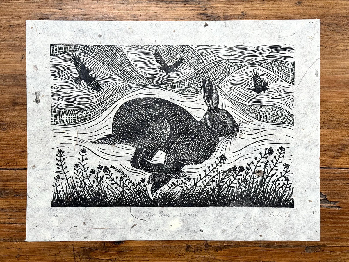 Linocut print of hare and crows