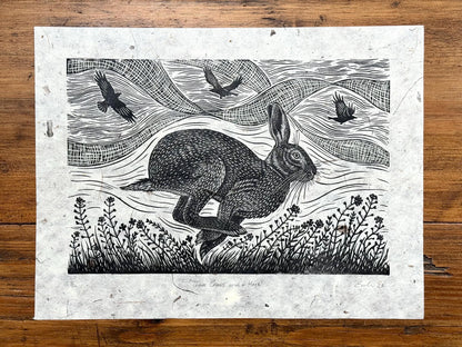 Linocut print of hare and crows
