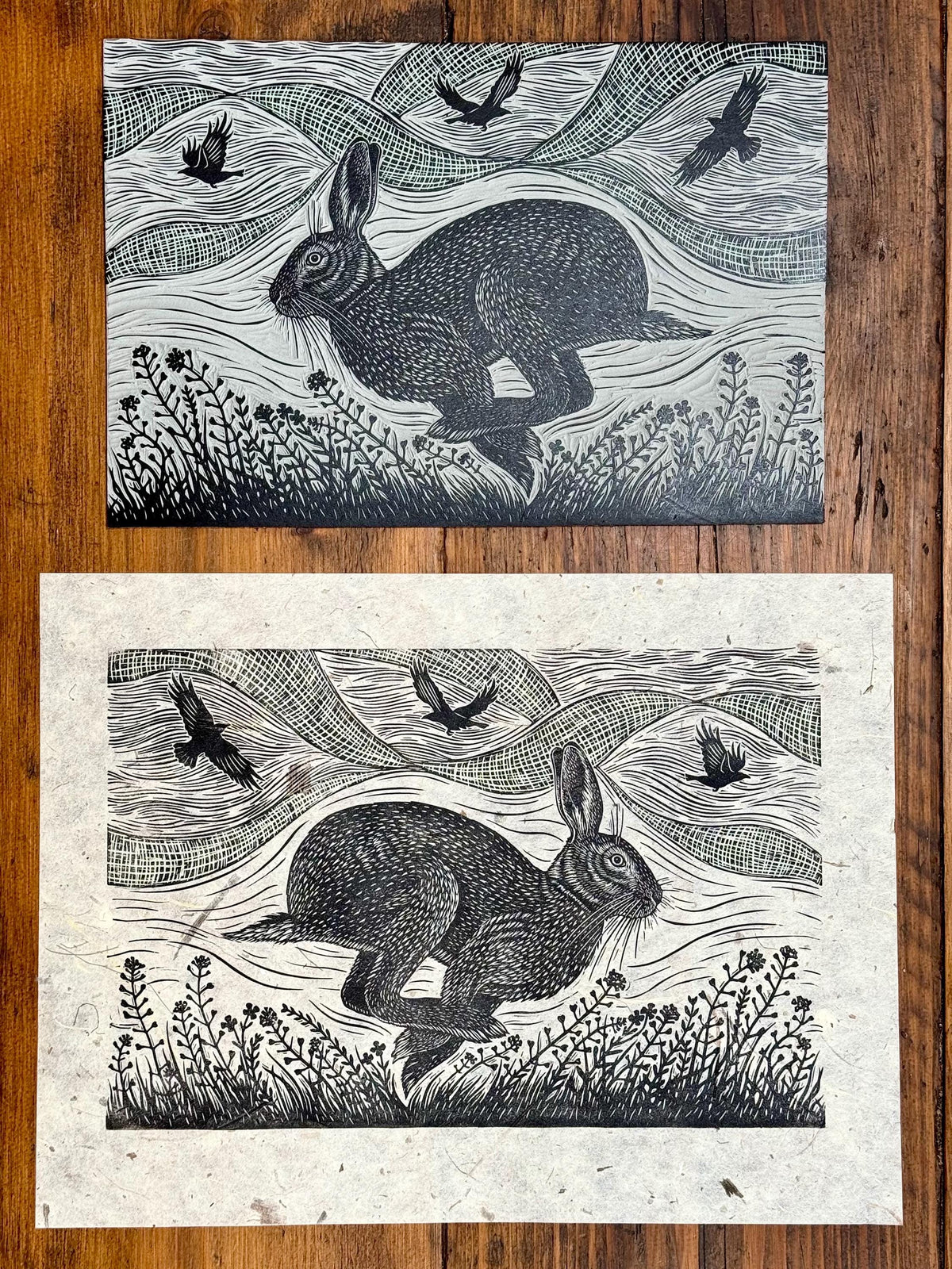 Linocut print of hare and crows
