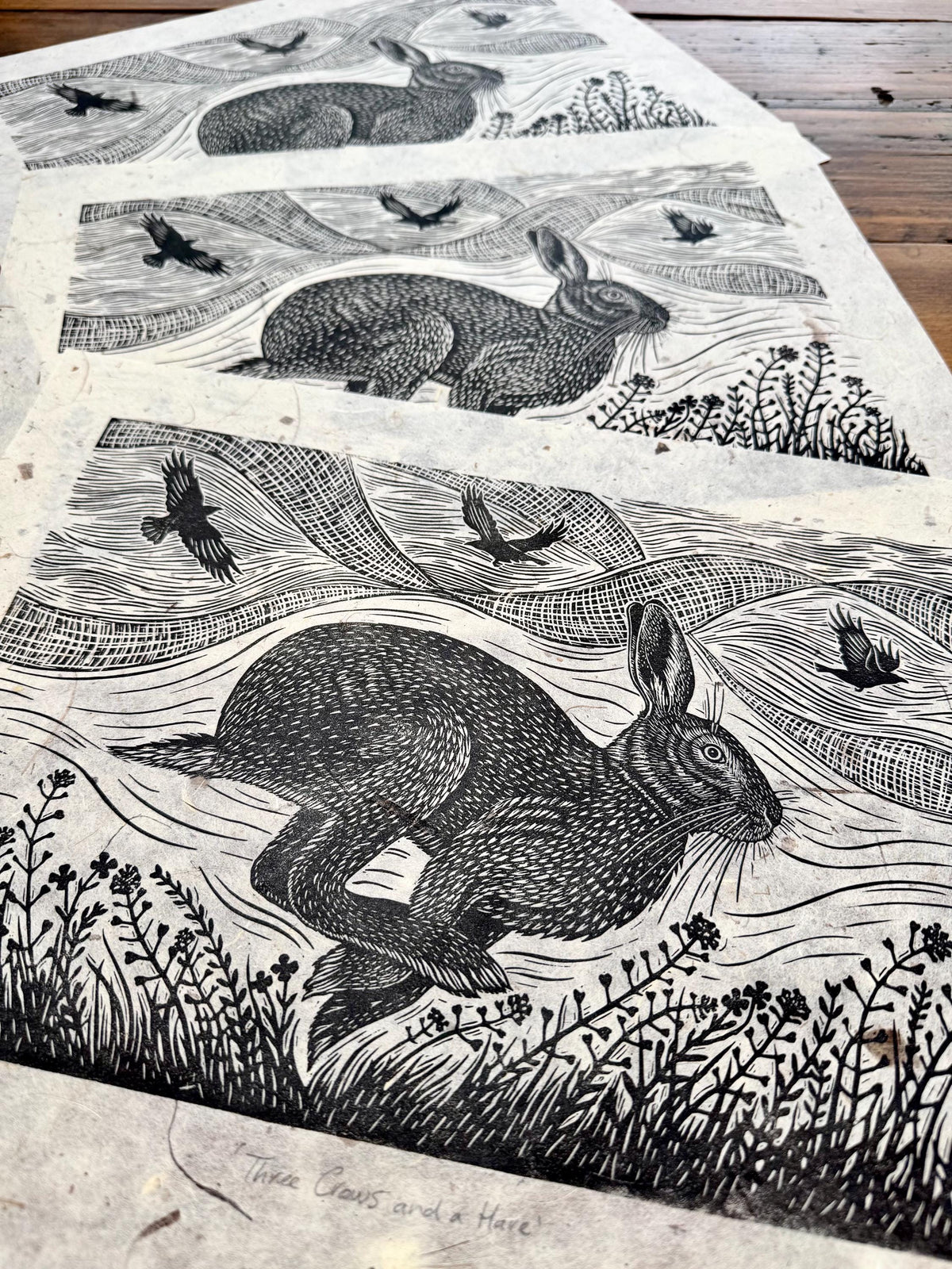 Linocut print of hare and crows