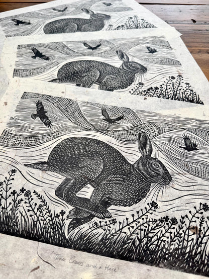 Linocut print of hare and crows